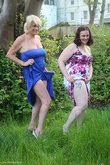 DivineMilfs. Dimonty and cheekyDee get topless in the garden Free Pic 2